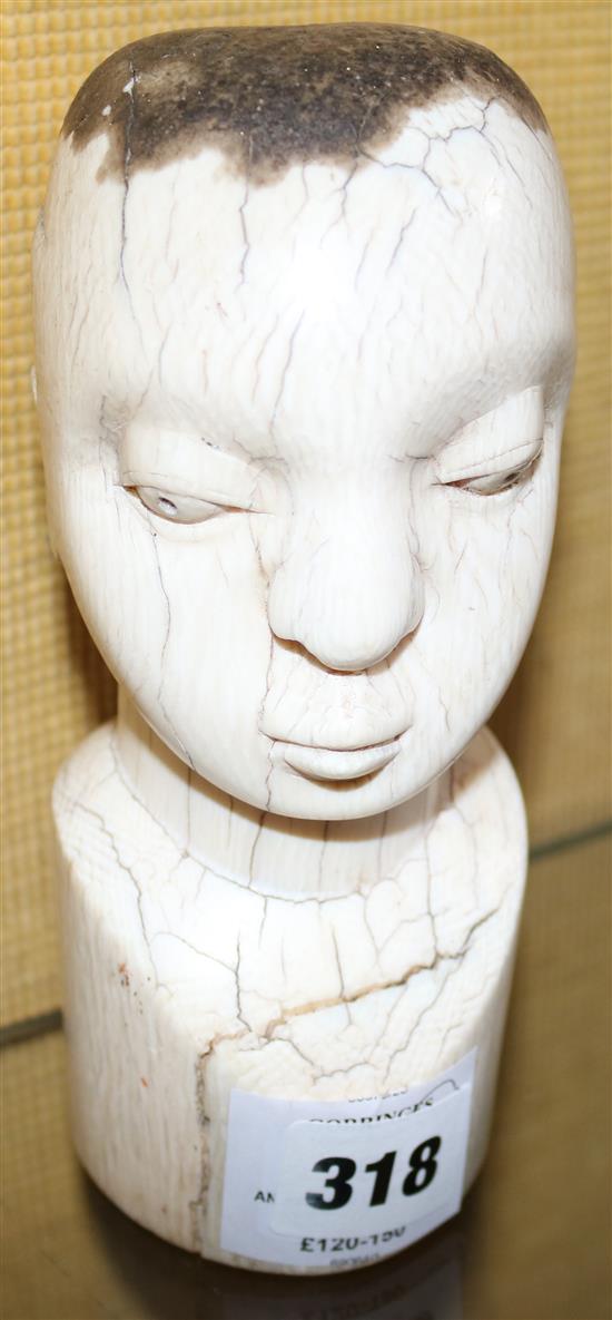 An African ivory bust(-)